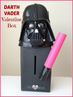 a darth vader valentine box with a pink tube sticking out of it's mouth