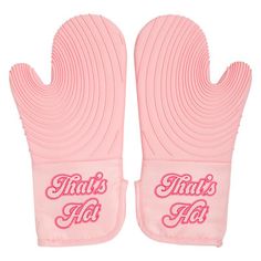 two pink oven mitts with the words that's hot on them