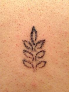 a tattoo on the back of a woman's neck