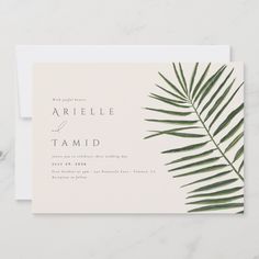 a wedding card with palm leaves on it