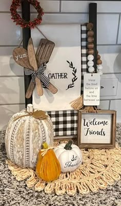 some pumpkins and other decorations on a counter