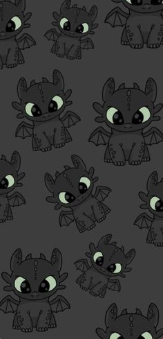 a bunch of little cartoon monsters with green eyes