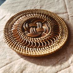 a woven basket sitting on top of a table