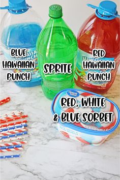 three bottles of red, white and blue toothbrushes on a marble counter top