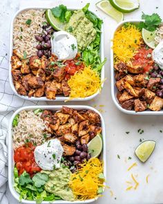 three white bowls filled with chicken, rice and black beans next to lime wedges