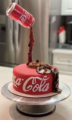 a coca - cola cake is being poured with chocolate