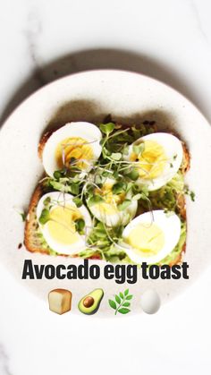 a white plate topped with an egg and salad on top of a marble countertop