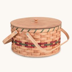 a wooden basket with handles and straps