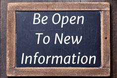 a sign that says be open to new information