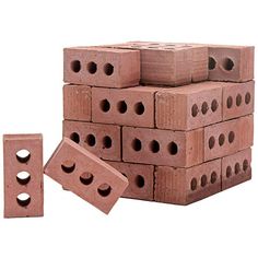 several bricks stacked on top of each other with holes in the middle and one block missing