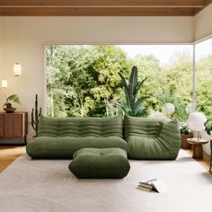 a living room filled with lots of furniture next to a large glass window covered in greenery