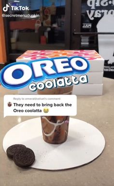 oreo cookies are sitting on a plate next to an ice cream sundae box