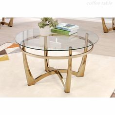 a glass and gold coffee table on a rug