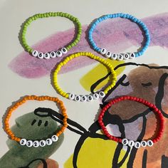 one direction x factor audition number bracelets - harry, louis, niall, zayn, liam 24 colours.  made to order. 5sos Bracelet Ideas, One Direction X Factor, Liam 1d, Number Bracelets