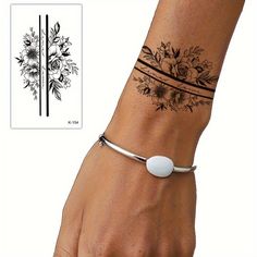 a woman's wrist with a flower tattoo on it