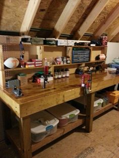 an unfinished workbench with lots of items on it