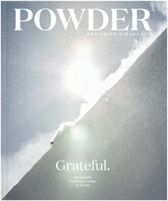 the cover of powderer magazine features a person skiing down a snowy hill with sun shining through clouds