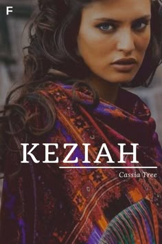 a woman wearing a colorful shawl with the words keziah written on it