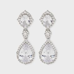 Whether you're stepping onto the dance floor or into the boardroom, let this pair of earrings be your statement piece. Fine jewelry without the hefty price tag, these cubic zirconia teardrop stone earrings offer the look & feel of expensive diamond earrings at a fraction of the cost. The teardrop shade adds a touch of elegance, making these earrings a timeless addition to your jewelry assortment. Step out in style and with our exquisite cubic zirconia teardrop stone earrings. Earrings For Quinceanera, Expensive Diamond, Clear Earrings, Silver Diamond Earrings, Yule Ball, Silver Jewelry Earrings, Gold Statement Earrings, Hoop Earring Sets, Accessories Jewelry Earrings