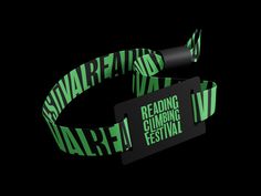 a black and green wristband with the words reading reading climbing festival printed on it