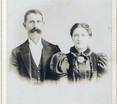 an old black and white photo of two people