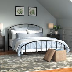 a bed room with a neatly made bed and two nightstands