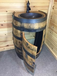 a sink made out of wooden barrels in a room