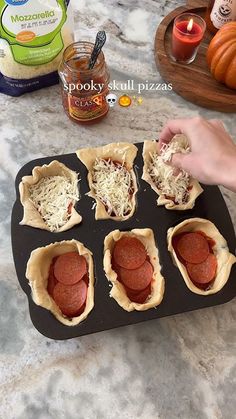 Spooky skull pizzas 🍕💀 #halloweenideas #halloweenfood #halloweenhacks #recipe #food Stuffed Skull Pizza, Pizza Skulls Recipe Video, Skull Pizza Bites, Skull Shaped Pizza, Halloween Skull Food, Skeleton Pizza Skulls, Skull Muffin Pan Recipes, Skull Shaped Food