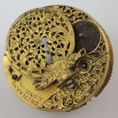 "This is an early verge pocket watch movement made by the famous maker DeCharme of London The movement has a broken balance and no chain. Movement - the deep gilt full plate verge movement has Egyptian style pillars and a large winged watchcock decorated with pierced work and also engraved with carved head flanked by two dogs. The movement is signed \"De Charme, London\" and is in 85% mint condition - some scratches and marks and not complete The movement does not have a dial or motion work The movement measures 40mm wide x 16mm deep" Egyptian Style, Pendant Watches, Two Dogs, Pocket Watches, Watch Movement, Silver Watch, Pocket Watch, Mint Condition, Jewelry Watches