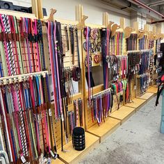 there are many ribbons on the shelves in this store that is filled with medals and other items