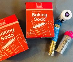 two boxes of baking soda next to one box of seasoning and another container of sugar