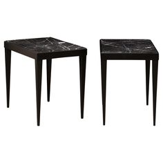 two tables with black marble top and legs