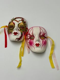 Vintage Festival face masks hand painted, cute for wall decorations, they have a few marks on them but otherwise perfect!  L 4"  W 3" Traditional Carnival Masks As Gifts, Artistic Masks For Carnival Gift, Artistic Carnival Masks As Gifts, Artistic White Masks As A Gift, Artistic White Masks As Gifts, Artistic White Masks For Festivals, Vintage Theater Masks For Carnival, Hand Painted White Mask, Traditional Carnival Eye Mask Masquerade