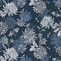 a blue and white floral print fabric with large flowers on it's side,