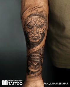 a man with a tattoo on his arm