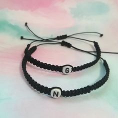 A Perfect matching bracelet! ideal gift to express your love and friendship to that special person in your life. (Black initials bracelet), You can choose different colors in the menus box. Include a (Wish card) Pinky promise bracelet. Bracelet Features: (1) 0.8mm Nylon Cord (2) Acrylic Letter Beads (3) Bracelet is adjustable MIN SIZE 5 INCHES TO 13 INCHES. if you want other size let me know. (4) Cord color options are available. Trendy Friendship Bracelets With Letter Print, Trendy Friendship Bracelets With Letter Print For Gift, Trendy Friendship Bracelets With Letter Print As Gift, Casual Personalized Braided Bracelets As Gift, Trendy Letter Bracelets For Friendship, Name Bracelet With Letter Print As Gift, Trendy Personalized Braided Friendship Bracelet, Personalized Black Braided Bracelet For Everyday, Black Personalized Braided Bracelet For Everyday