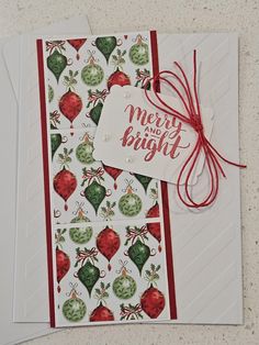 two christmas cards with red and green ornaments on them