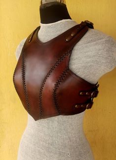 a mannequin wearing a brown leather corset