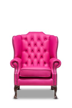 a pink leather chair with wooden legs and nail polishing on the armrests