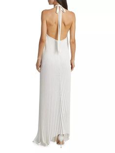 This asymmetric gown from L'Idée is finished withtheatrical pleats and a sleek open back. The sleeveless style features a self-tie halterneck and a sleek open back..Halterneck, back tie closure.Sleeveless.Open back.Concealed back zip closure.100% polyester.Machine wash.Imported.SIZE & FIT.About 48.5-60' from shoulder to hem.Model measurements: 5'10' tall.Model is wearing a US size 4.This asymmetric gown from L'Idée is finished withtheatrical pleats and a sleek open back. The sleeveless style features a self-tie halterneck and a sleek open back.Halterneck, back tie closureSleevelessOpen backConcealed back zip closure100% polyesterMachine washImportedSIZE & FITAbout 48.5-60' from shoulder to hemModel measurements: 5'10” tallModel is wearing a US size 4 Chic Pleated Cocktail Gown, Chic Maxi Gown For Dinner, Chic Maxi Length Dinner Gown, Elegant Sleeveless Pleated Evening Dress, Gala Pleated Back Backless Dress, Backless Pleated Back Dress For Gala, Chic Pleated Evening Dress For Dinner, Pre-draped Sleeveless Maxi Dress For Dinner, Backless Pleated Bodice Gala Dress