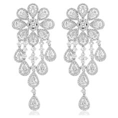 18K White gold diamond cluster earrings features 16.45 carats of diamonds. G-H in Color VS - SI in clarity (28 PEAR - 9.10CTS; 564 ROUND - 7.35CTS) Chandelier Flower, Yellow Diamond Earring, Diamond Chandelier Earrings, Diamond Chandelier, Gold Chandelier Earrings, Diamond Cluster Earrings, Morganite Diamond, Flower Earring, Gold Chandelier