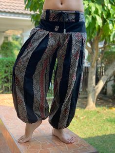 "These super soft rayon baggy unisex harem pants have the \"flow\", perfect of yoga or just a cool strolling. Comfort and character are what these pants are all about. They have the traditional sarong look & feel but a lot more practical when it comes to activity like yoga. As a bonus, they are convertible! Just pull them up and you get yourself a cute jumpsuit in a flash. Together with elastic cuff legs, you can wear them short or long. The pants have smock waist (wide bang elastic) with no Cotton Hippie Harem Pants For Meditation, Hippie Cotton Harem Pants For Meditation, Loose Fit Harem Pants For Yoga And Festivals, Traditional Wide Leg Harem Pants For Meditation, Traditional Harem Pants For Meditation, Black Bohemian Harem Pants With Relaxed Fit, Black Hippie Harem Bottoms, Traditional Harem Pants For Yoga, Black Bohemian Relaxed Fit Harem Pants