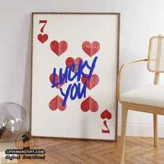 a poster with the words lucky you on it next to a chair