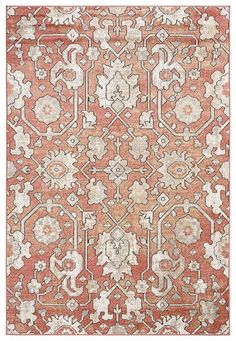 an orange and white rug with intricate designs