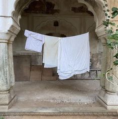 clothes hanging out to dry in an old building