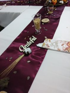 the table is set for a celebration with confetti and wine glasses on it