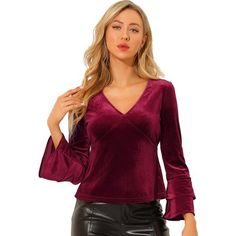 There's nothing like a touch of velvet to elevate your style, and this blouse also features a V-neck and elastic waist for a put-together look. This velvet blouse is perfect for pairing with everything-high-rise in your closet. Get your shimmer on in this chic yet simply styled velvet blouse. Elevate your style in this V-neck blouse made from soft velvet. Party Velvet V-neck Top, Chic Long Sleeve Velvet Blouse, Chic Velvet V-neck Top, Velvet Tops For Fall Night Out, Elegant Long Sleeve Velvet Tops, Elegant Velvet Blouse For Fall, Elegant Long Sleeve Velvet Blouse, Chic Velvet Tops For Fall, Long Sleeve V-neck Top For Fall Party