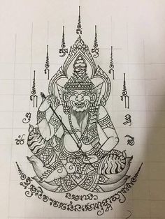 a drawing of a buddha sitting on top of a table