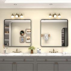 a bathroom with double sinks and two mirrors on the wall next to eachother