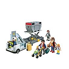 a group of people standing next to each other in front of a toy truck with a conveyor belt